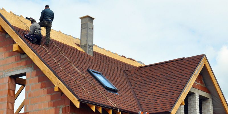 men working on roof